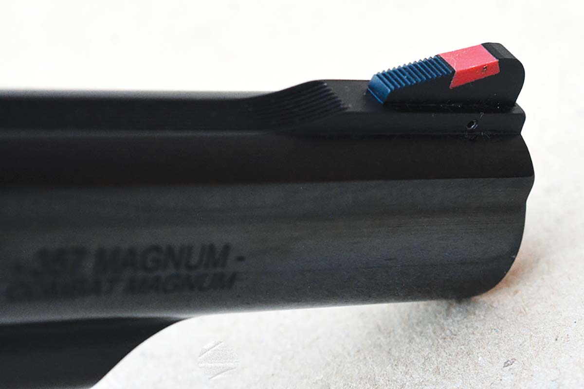 The front sight is ramped and features a red insert.